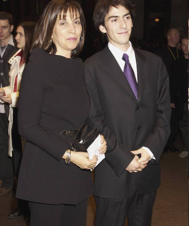 Olivia, George Harrison's wife, and son Dhani, upon arrival at the "Concert for George"  in 2003.