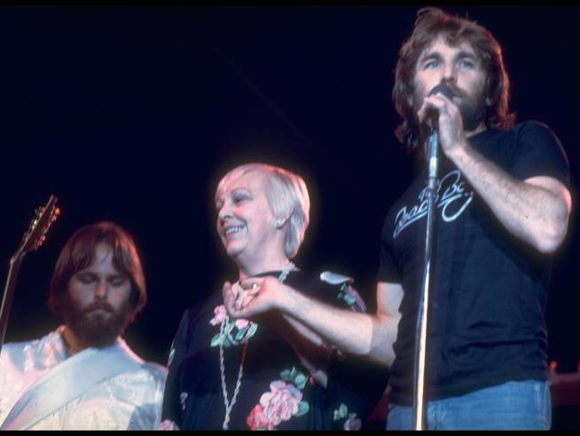 Carl Wilson and Dennis Wilson of the Beach Boys with their mother at a 1976 concert