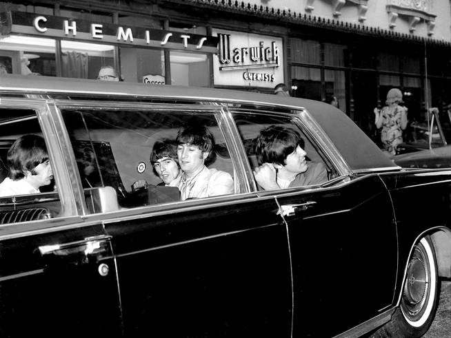 The Beatles leave the Warwick Hotel in a limousine towards Shea Stadium