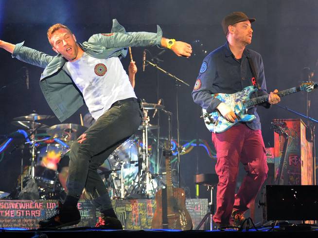 Chris Martin and Jonny Buckland of Coldplay performing at Piedmont Park in Atlanta