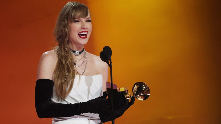 Taylor Swift receives an award at the 2024 Grammy Awards on February 4 in Los Angeles