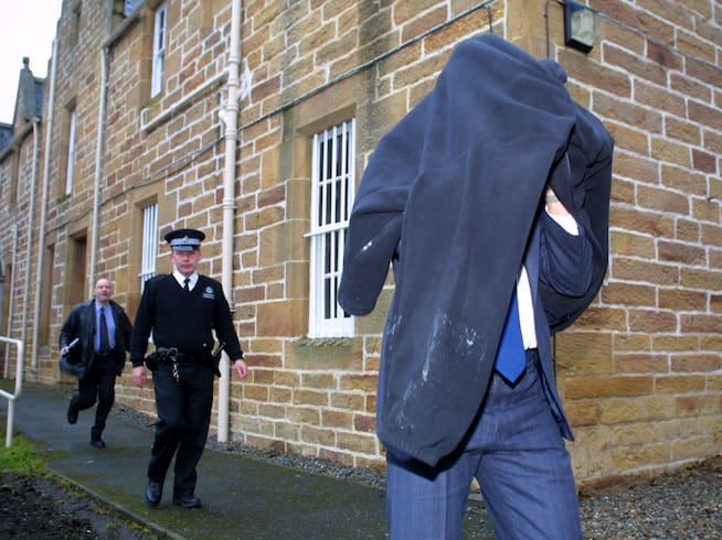 Robert Podesta leaving the courthouse