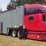 couples behind teh truck