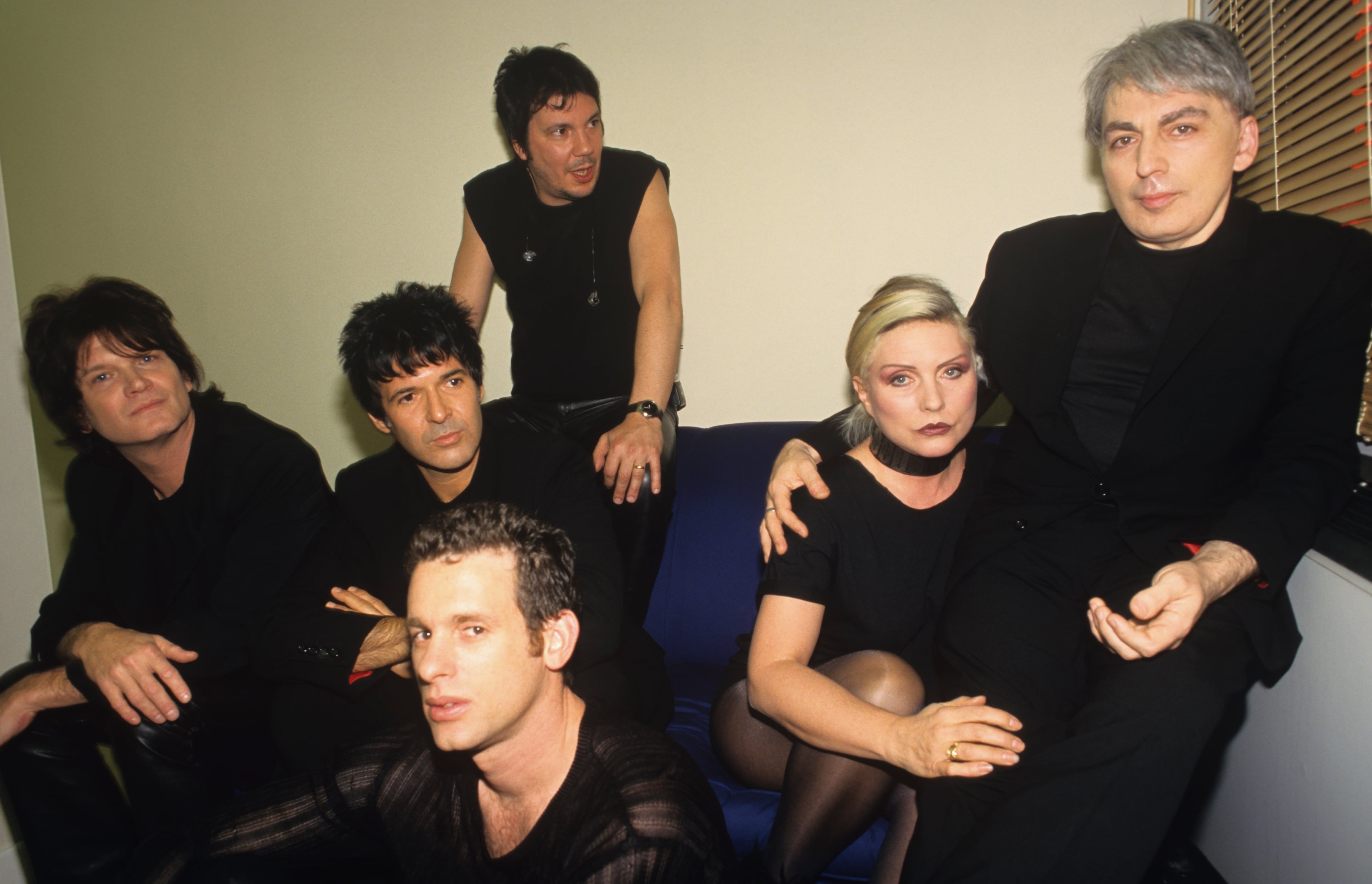 From left to right: Leigh Foxx, Clem Burke, Paul Carbonara (front), Jimmy Destri, Debbie Harry and Chris Stein of Blondie, pictured backstage at a concert in 1999. (Photo by Patrick Ford/Redferns)