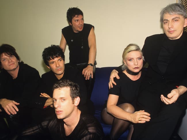 From left to right: Leigh Foxx, Clem Burke, Paul Carbonara (front), Jimmy Destri, Debbie Harry and Chris Stein of Blondie, pictured backstage at a concert in 1999. (Photo by Patrick Ford/Redferns)