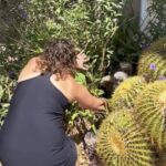 Woman finds a fluffy baby behind a cactus